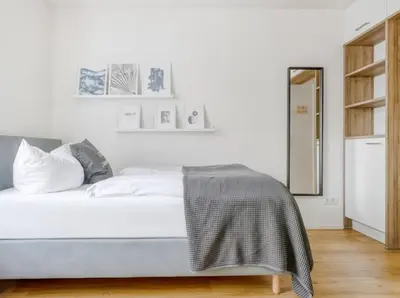 Ein Bett oder Betten in einem Zimmer der Unterkunft My Suite - Augsburg City - Netflix