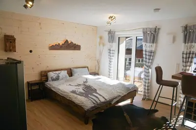 Ein Bett oder Betten in einem Zimmer der Unterkunft Wohnung Heuberg im Inntal mit Hot Tube - zentral & ruhig