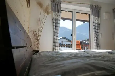 Ein Bett oder Betten in einem Zimmer der Unterkunft Wohnung Wendelstein mit Bergblick im Inntal - zentral & ruhig