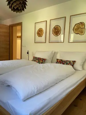 Ein Bett oder Betten in einem Zimmer der Unterkunft FeWo Rainerweber Sunseitn