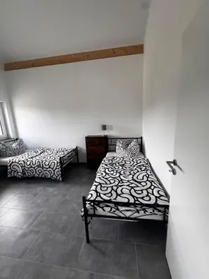 Ein Bett oder Betten in einem Zimmer der Unterkunft Steinhöring Bade Appartements
