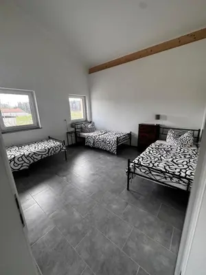 Ein Bett oder Betten in einem Zimmer der Unterkunft Steinhöring Bade Appartements