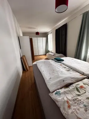 Ein Bett oder Betten in einem Zimmer der Unterkunft A&B Ferienwohnungen