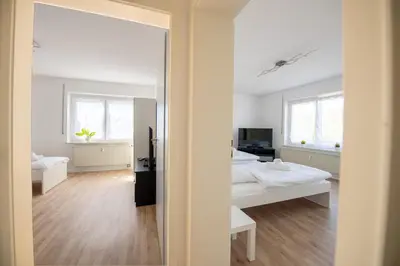 Ein Bett oder Betten in einem Zimmer der Unterkunft WundP Living Wohnung mit Terrasse Parkplatz