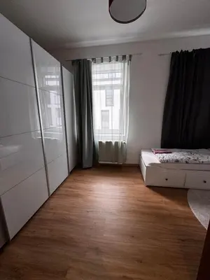 Ein Bett oder Betten in einem Zimmer der Unterkunft Aby Deluxe Wohnung