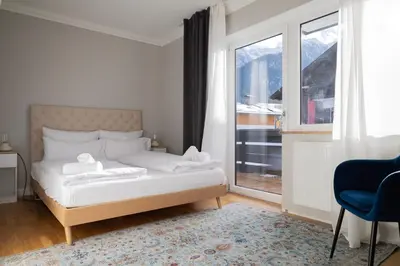Ein Bett oder Betten in einem Zimmer der Unterkunft Holiday rental Eschenlohe, Balcony Apartment with Mountain Views