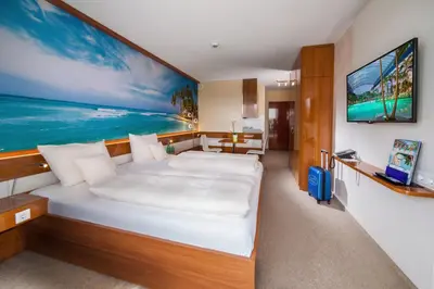Ein Bett oder Betten in einem Zimmer der Unterkunft Victory Gästehaus Therme Erding