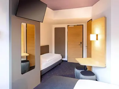 Ein Bett oder Betten in einem Zimmer der Unterkunft B&B Hotel München City-Ost