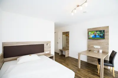 Ein Bett oder Betten in einem Zimmer der Unterkunft Come IN Hotel