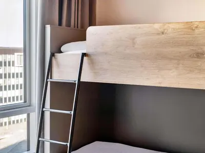 Ein Bett oder Betten in einem Zimmer der Unterkunft B&B HOTEL München-Messe