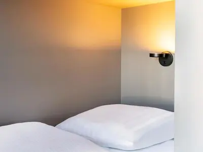 Ein Bett oder Betten in einem Zimmer der Unterkunft B&B HOTEL München-Schwabing