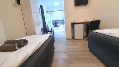 Ein Bett oder Betten in einem Zimmer der Unterkunft Neuburg Downtown Apartements