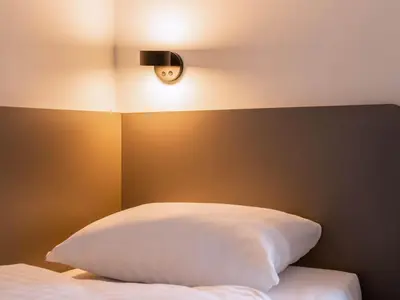 Ein Bett oder Betten in einem Zimmer der Unterkunft B&B Hotel Augsburg-Nord
