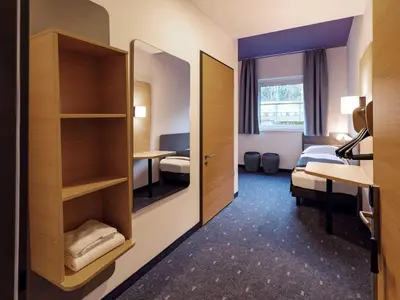 Ein Bett oder Betten in einem Zimmer der Unterkunft B&B Hotel München-Hbf