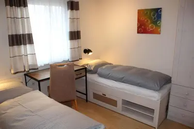 Ein Bett oder Betten in einem Zimmer der Unterkunft Ferienhaus Nr 81, Typ A, Feriendorf Hochbergle, Allgäu